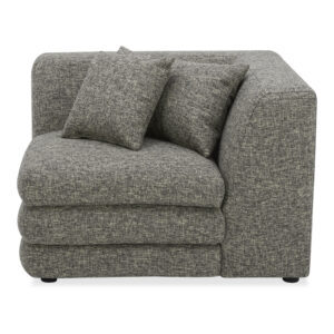 the Lowtide corner chair showcases a layered appearance that promotes comfort. Its vintage influence and understated elegance are enhanced by the use of textured fabric. On its own or combined as a modular sectional