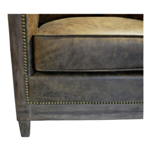 the Darlington club chair's rustic roots meet modern industrialism. Warm hues of soft