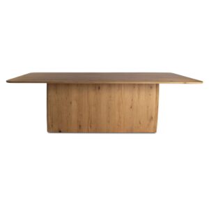 The Winston dining table's commanding plinth base features softly rounded edges at all four corners