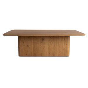 The Winston coffee table's commanding plinth base features softly rounded edges at all four corners
