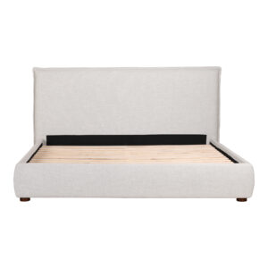offering both comfort and lasting appeal with its flanged edges. The bed's timeless design and neutral hues exude a classic