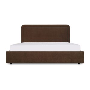 A bed with a hidden trick. The Simon Bed features a rounded silhouette with piped detailing