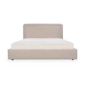 A bed with a hidden trick. The Simon Bed features a rounded silhouette with piped detailing