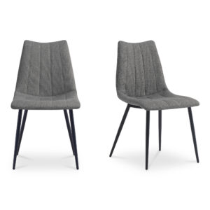 A new take on contemporary dining. The Alibi dining chair’s sleek modern aesthetic features striking vertical accent stitching