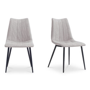A new take on contemporary dining. The Alibi dining chair’s sleek modern aesthetic features striking vertical accent stitching
