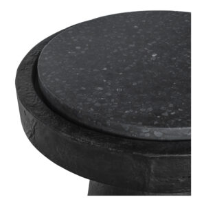 a display of cement and terrazzo combined with a dark and moody color scheme. Its sculpted cement base has a hand-crafted rustic feel