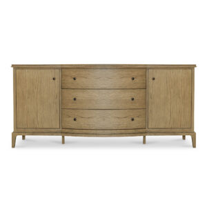 The Sadie sideboard's gentle curves and wire-brushed oak finish embrace modern traditionalism. The artfully designed overhang with rounded edges and curved front offers a soothing visual rhythm. Three middle drawers provide ample storage