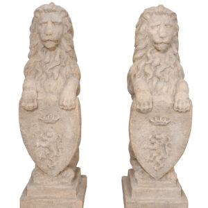 A Heraldic Lion Set of 2 in rough stone each stands 11.5 inches wide X 10 inches deep X 31.75 inches tall. The set positions 2 upright lions heralding Cote D Arm Crests. Let this well sized set stand guard of your domain by positioning on either side of an entryway or placing them for balance and symmetry on either side of a mantel