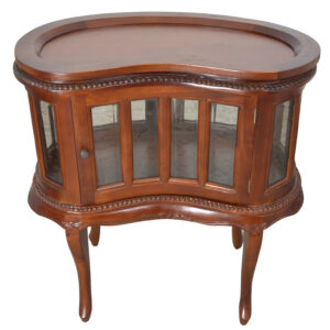 a shapely display cabinet surrounded by individual beveled glass panels and a door atop 4 legs. The item is hand carved in mahogany with a mahogany finish. Made by hand and imported from Indonesia.