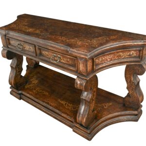The Inca Grand Console Table is a large console table from our Inca Series at 72" wide and 36" tall. This series boasts a Spanish influence with large scaled details and its multi layered finish of light and dark sienna and brown tones with subtle natural contrasts resulting from hand rubbing and exposing the rich wood undertones then delicately detailed with hand painted soft scrolls. While this a perfect stand alone entry or hall console for a larger pairing consider matching with other items from our Inca series Cocktail/Coffee and/or End tables. The Inca Series is from our Santa Lucia Collection which consists of handmade