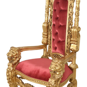 with fine hand carved details on both the front as well as the back and carved regal lion masks flanking each arm all of which adds to the prominence. This regal seat is upholstered and for added drama a plush deep Red Velvet is used. The chair is hand carved out of solid Mahogany and finished in an extensive hand applied stunning gold leaf. Another exclusive design and finish from our Heritage Collection