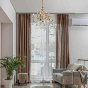 featuring a brushed silver finish and accented with exquisite cognac-colored crystals from China. This elegantly crafted chandelier blends classic aesthetics with modern functionality