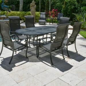 the 7 Piece Dining Set includes six tall shapely contoured armchairs and an 86-inch-long oval table.  Each piece in the oval dining set features a rich ebony finish with hand-applied silvery white accents