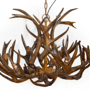 Bring a touch of the wild into your home with the Rustic Six Light Faux Deer Horn Antler Chandelier. This unique lighting fixture is expertly crafted to mimic the natural beauty of deer antlers
