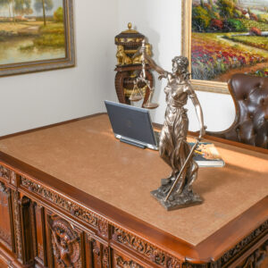 the blindfold on her represents no preconceived determination. The re-creation was Artist sculpted and then hand cast in Polyresin. It features our special and rich Platine metal plated finish. A finish that enables the artists to burnish and polish the details creating a very expensive looking yet affordable decorative art.