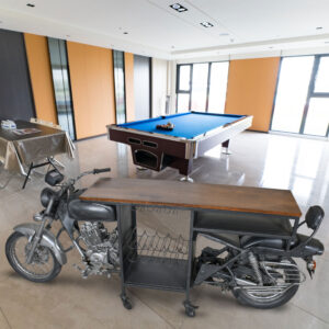 a remarkable one-of-a-kind discovery for vintage motorcycle enthusiasts and those seeking distinctive interior design pieces. This authentic vintage motorcycle has been artfully repurposed into a wine bar and counter