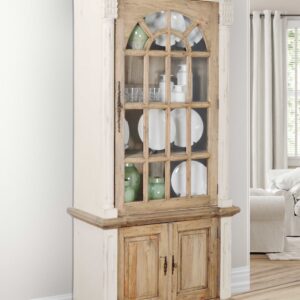 The Farmhouse Tall Cabinet Hutch in White Chalk and Natural is 41.25 wide x 18.5 deep x 84.5 tall inches. It features a classic arched glass paneled door opening to shelving