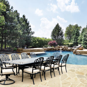 Introducing the 11pc Elisabeth Extension Dining Table Set is a luxurious patio set designed to elevate your outdoor dining experience. Part of the Elisabeth Collection by Bridgeton Moore