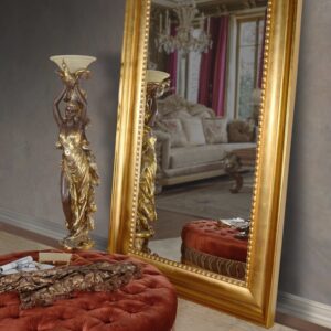 BUYER BEWARE ** The Mammoth Wood Mirror with Gold Leaf Finishing is one of the largest solid wood Mirrors available. This Mirror creates a major statement of Clean yet Massive Grandeur. Perfect for Commercial Applications in need of Spectacular. It is made in solid wood and finished by hand with stunning hand applied Gold Metal Leaf finishing. Gold finishing one of the popular finishes available on this large profile which is also offered in Silver leaf or Seasoned Wood. While this huge mirror is popular for simply floor leaning use