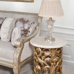 The Platine Hand Carved Round Side Table w Crema Marble 24 Inches Tall is completely Hand Carved from solid Mahogany. Hand Made and Hand Finished by the Master Carvers and Finishers of the Heritage company. Rare to find in this quality of workmanship. The Platine finish with hues of Champagne Golden Silver is equally spectacular