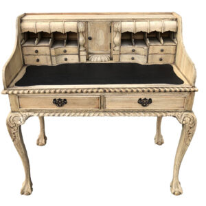 ball and claw feet and an abundance of drawers including many secret compartments atop a leather writing surface. This beautiful recreation offers functional use and fun for the owner to explore and find all the hidden compartments designed to hide your secret treasures. The finish is a current trend