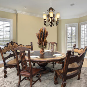 The Juliana Round Dining set boasts a Spanish influence with large
