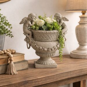 a timeless blend of classic design and artistic craftsmanship. Featuring two intricately detailed cherubs perched on either side