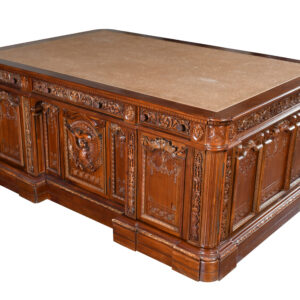 Experience a piece of history in your own workspace with the Resolute Desk replica from Heritage Furniture. This exquisite reproduction pays homage to the renowned desk used by several U.S. Presidents in the Oval Office