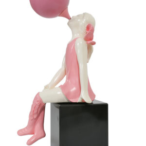 Bubblegum Girl is a chic 20-inch decorative sculpture. This pop art-inspired piece features a girl seated on a pedestal; her head slightly tilted up as she blows a bubble with bubblegum. Perfect for tabletops or shelves