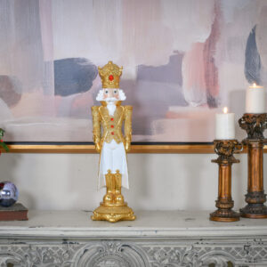 it stands as a symbol of festivity and tradition. The figure’s stately crown