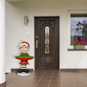 the epitome of holiday charm and whimsy. This delightful elf figure is meticulously crafted and features a hand-painted finish in festive holiday colors that evoke the magic of the season. To enhance its allure