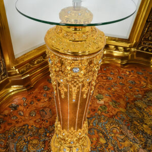 standing tall at 47 inches with a regal allure. This exquisite pedestal features a glass top