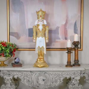 clad in gleaming gold regalia. His royal attire is meticulously detailed