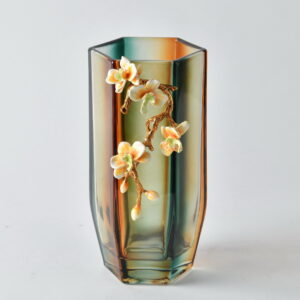 Elevate your floral displays with the stunning Amber Bloom Hexagonal Vase. This elegant 11.02 inch tall vase features a rich gradient of amber and green hues