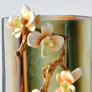 this 10.63 inch tall vase showcases a stunning amber and green ombre finish. Its hexagonal shape and artistic detailing make it an ideal statement piece for side tables