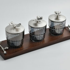 Elevate your tabletop elegance with the Silver Monarch Butterfly Jar Set — a striking trio of glass jars nestled on a rich wooden tray