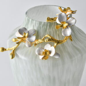 this tall and elegant vase features a refined sage and white speckled glass body