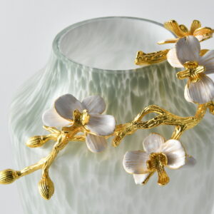 topped with a stunning sculpted gold branch and delicate pearlescent blossoms. A timeless piece of art and function