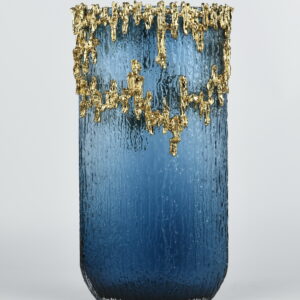 Make a bold statement with the Blue Cascade Luxe Vase—a stunning fusion of modern elegance and artistic flair. Featuring a rich cobalt blue body with a textured finish
