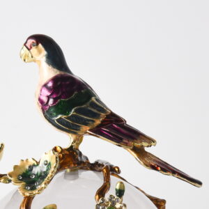 a captivating piece that blends elegance with artistry. Perched atop a blooming