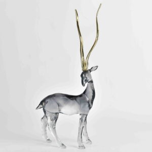 Command attention with the majestic elegance of the Stag Sculpture with Gold Antlers. Featuring a sleek